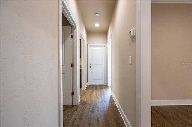 hall with dark hardwood / wood-style floors