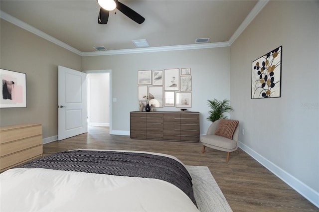 bedroom with ceiling fan, crown molding, and dark hardwood / wood-style floors