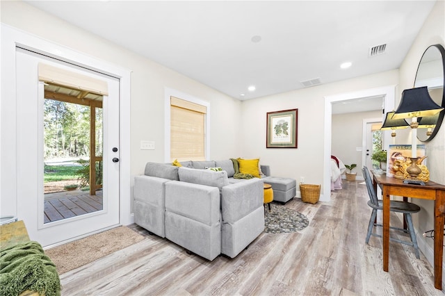 living room with light hardwood / wood-style floors