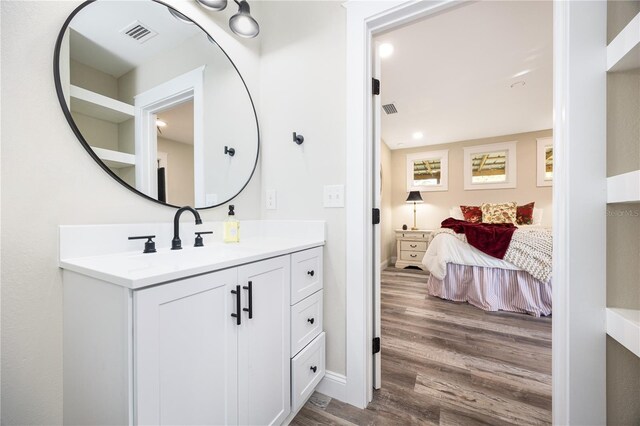 bathroom with vanity and wood-type flooring