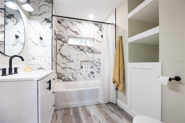 bathroom with vanity, shower / bath combination with curtain, and wood-type flooring