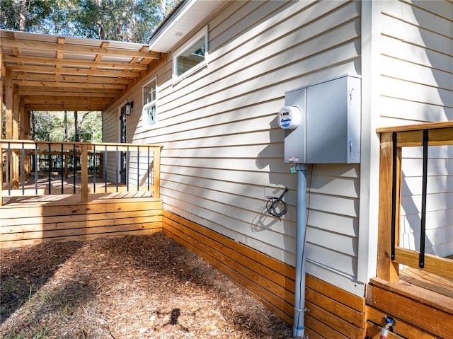 view of home's exterior with a wooden deck