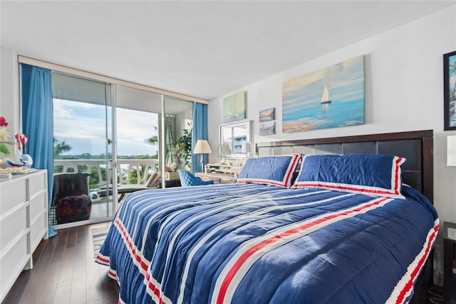 bedroom with expansive windows and dark wood-type flooring