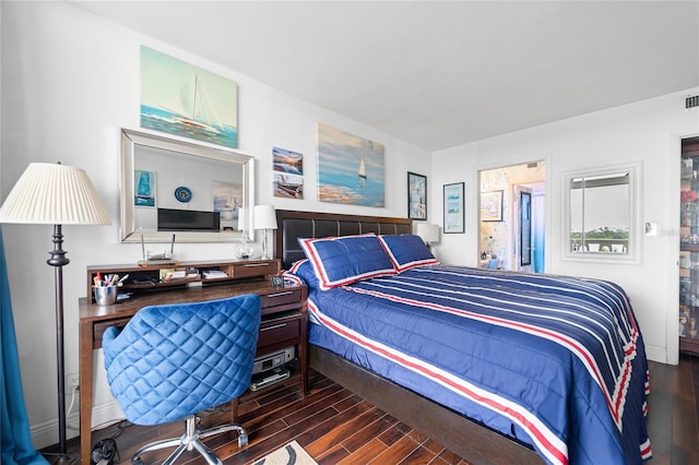 bedroom with dark hardwood / wood-style floors