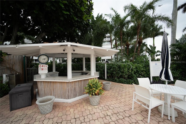 view of patio with an outdoor bar