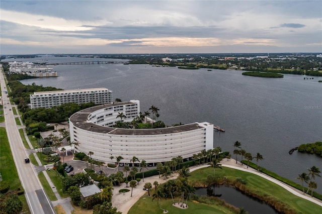 aerial view at dusk with a water view