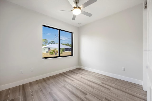 unfurnished room with ceiling fan and light hardwood / wood-style flooring