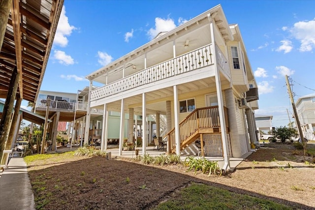 back of house with ceiling fan