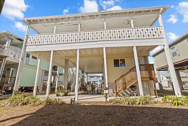 rear view of house with ceiling fan