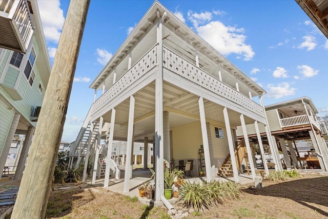 rear view of house featuring a balcony