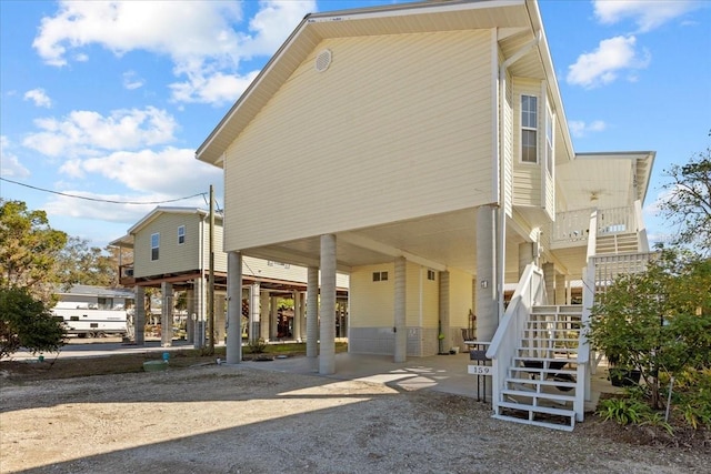 view of side of home with a carport