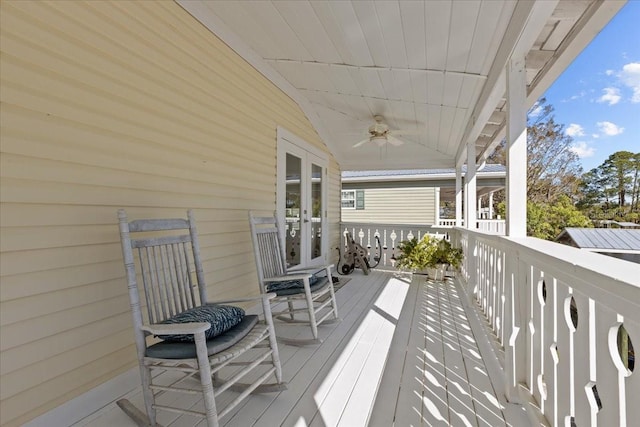 deck with ceiling fan and french doors