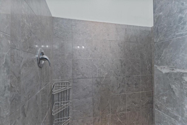 details with a tile shower