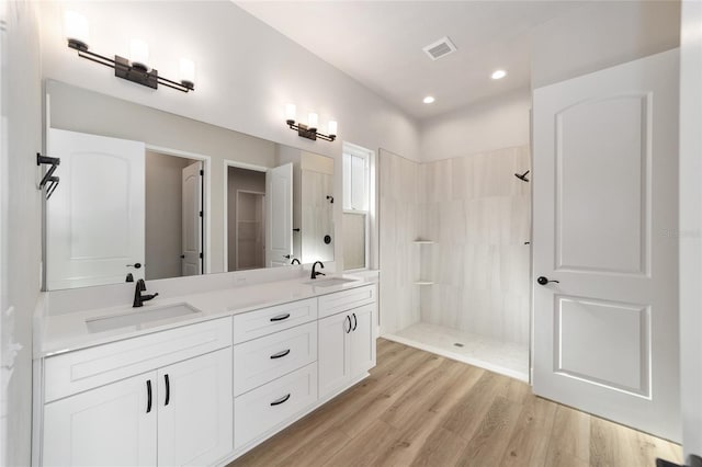 1069 NW 132nd Blvd, Newberry, FL 32669 - full bath with a walk in shower, double vanity, wood finished floors, and recessed lighting