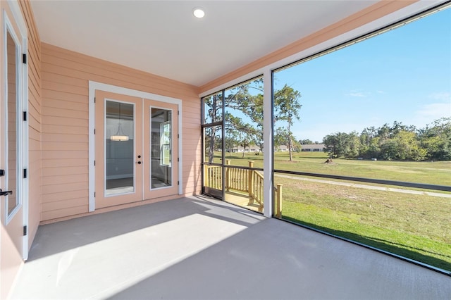 unfurnished sunroom with french doors and a wealth of natural light