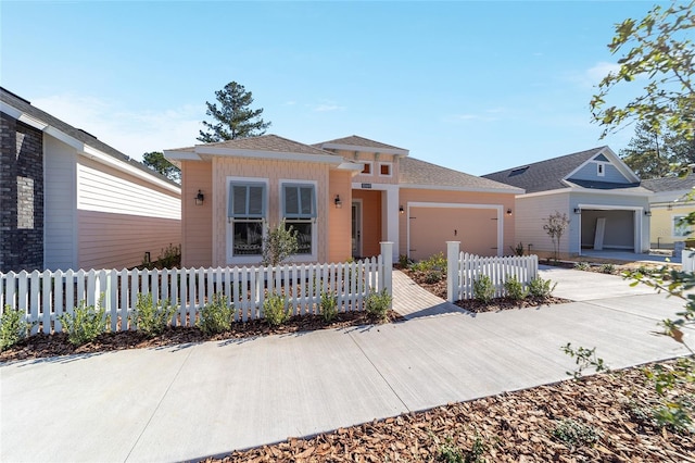 1069 NW 132nd Blvd, Newberry, FL 32669 - view of front of home with an attached garage, a fenced front yard, and concrete driveway