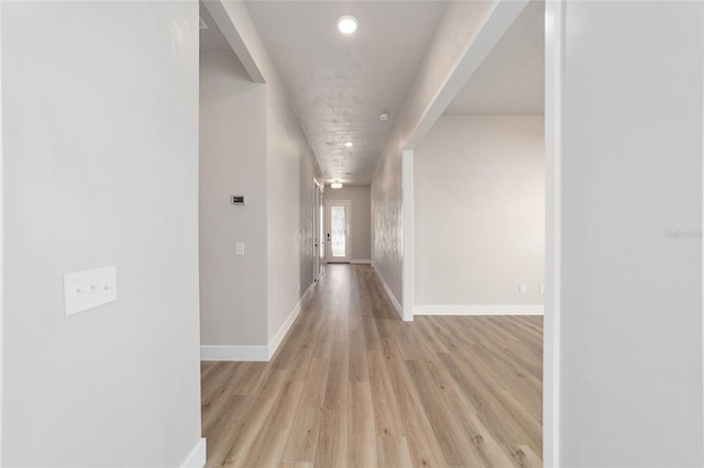 hallway with light wood-type flooring