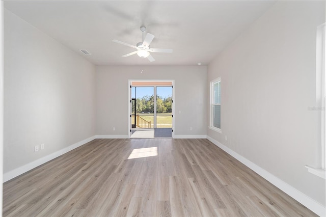 spare room with light hardwood / wood-style floors and ceiling fan