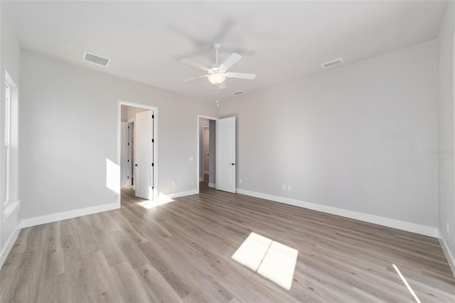 spare room with ceiling fan and light hardwood / wood-style flooring