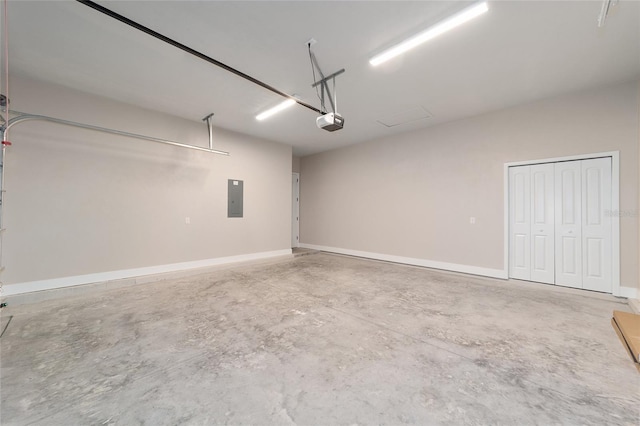 garage with electric panel and a garage door opener