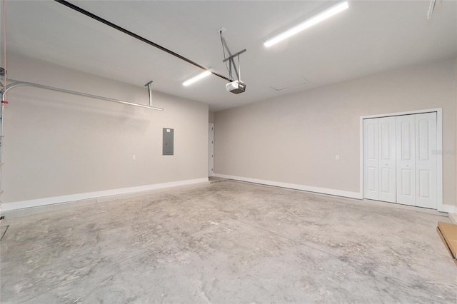 1069 NW 132nd Blvd, Newberry, FL 32669 - garage featuring a garage door opener, electric panel, and baseboards