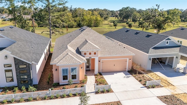 1069 NW 132nd Blvd, Newberry, FL 32669 - view of front facade with an attached garage, driveway, and roof with shingles