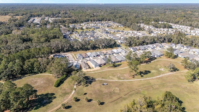 1069 NW 132nd Blvd, Newberry, FL 32669 - aerial view of property's location with nearby suburban area and a heavily wooded area
