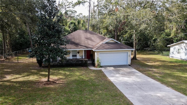 view of front of property with a front lawn, covered porch, and a garage