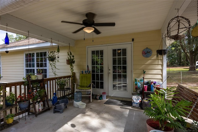 entrance to property featuring french doors, ceiling fan, and a patio area