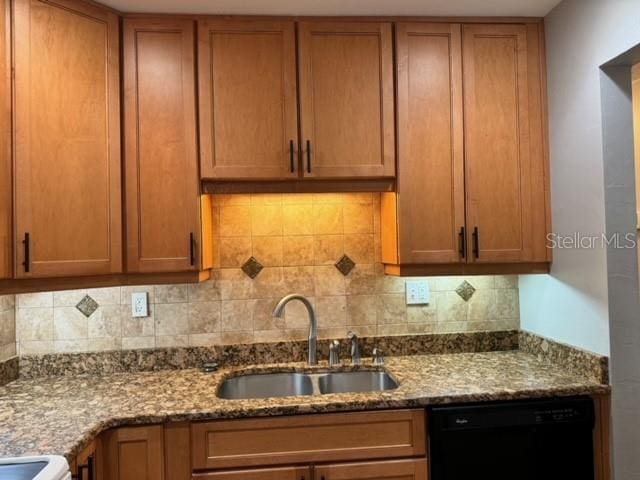 kitchen with dishwasher, white range, sink, decorative backsplash, and light stone countertops