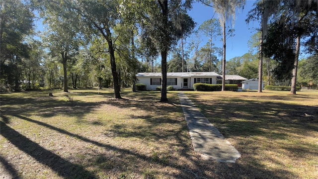 ranch-style house with a front yard