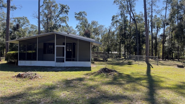 view of yard with a sunroom