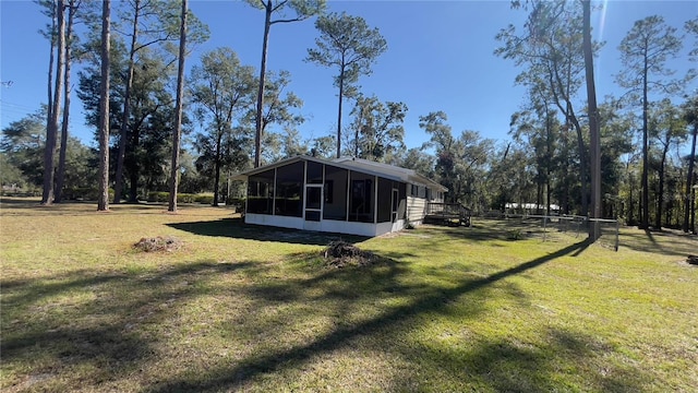 view of yard featuring a sunroom