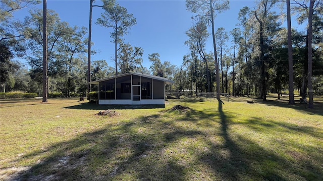 view of yard with a sunroom