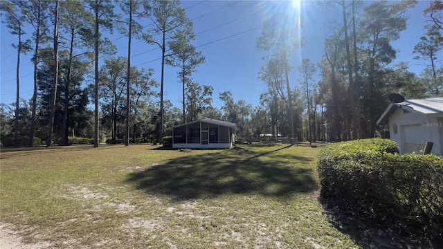 view of yard featuring a sunroom