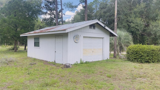 garage with a lawn