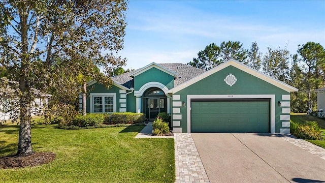 single story home with a front yard and a garage