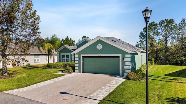 single story home featuring a garage and a front lawn