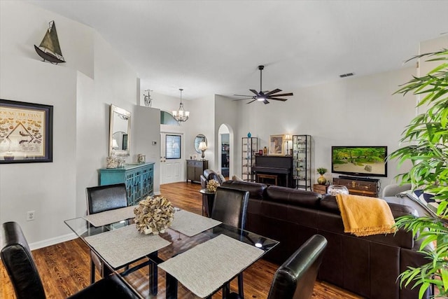 dining room featuring hardwood / wood-style floors and ceiling fan with notable chandelier