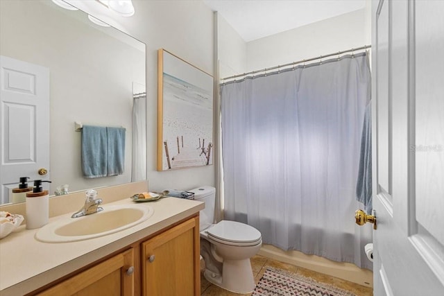 full bathroom featuring toilet, vanity, tile patterned floors, and shower / bathtub combination with curtain