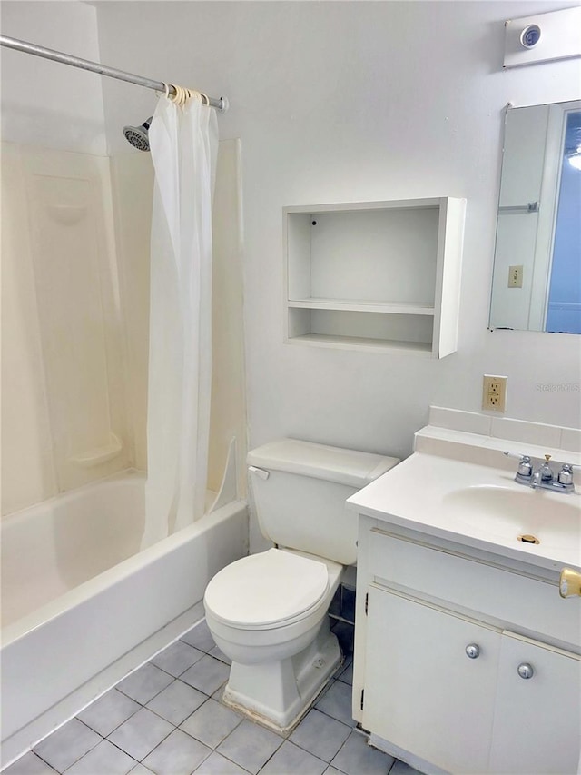 bathroom featuring toilet, shower / bath combo, tile patterned flooring, and vanity