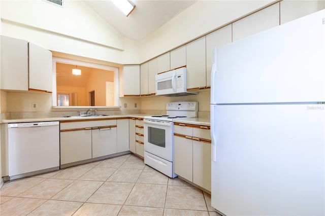 kitchen featuring white cabinets, white appliances, sink, and vaulted ceiling