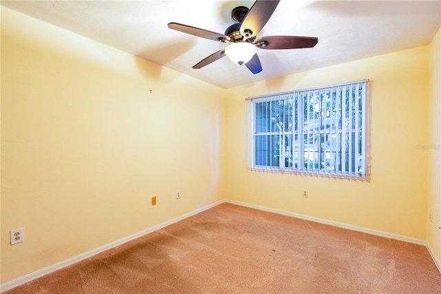 unfurnished room with carpet flooring and ceiling fan