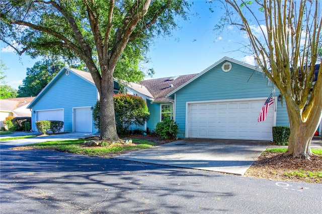 single story home featuring a garage