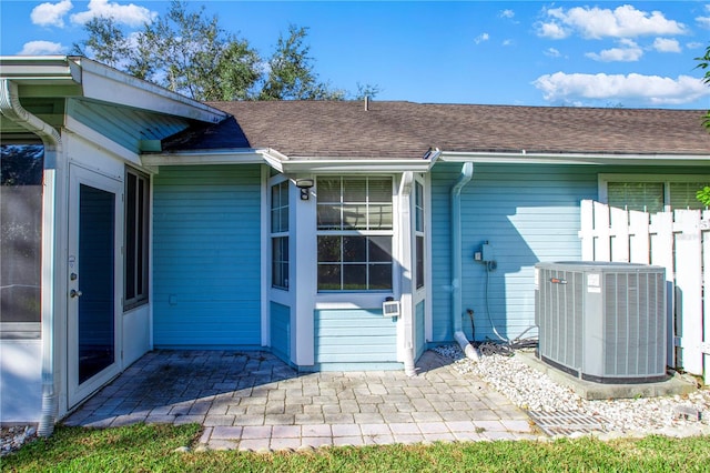 entrance to property with central AC unit