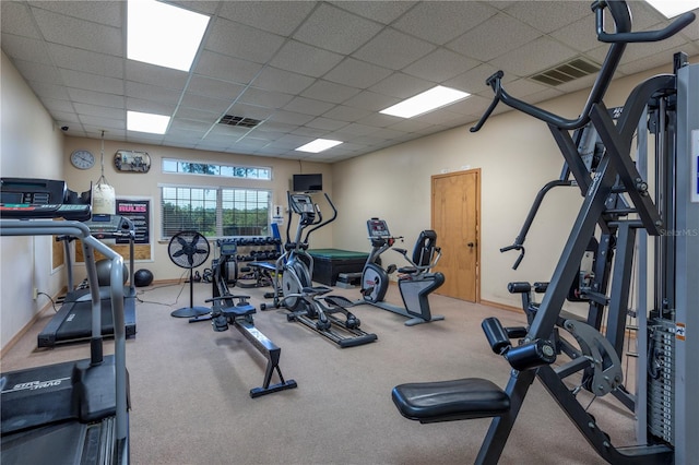 workout area featuring a paneled ceiling