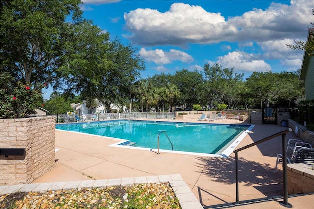 view of swimming pool with a patio