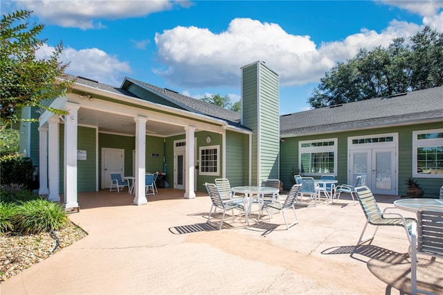 rear view of property featuring a patio and french doors