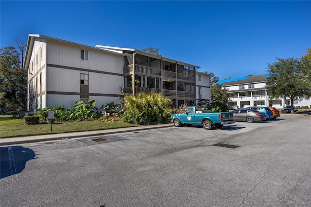 6519 W Newberry Rd Unit 108, Gainesville, FL 32605 - view of building exterior featuring uncovered parking