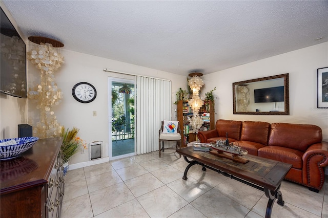 6519 W Newberry Rd Unit 108, Gainesville, FL 32605 - living room with a textured ceiling and light tile patterned flooring